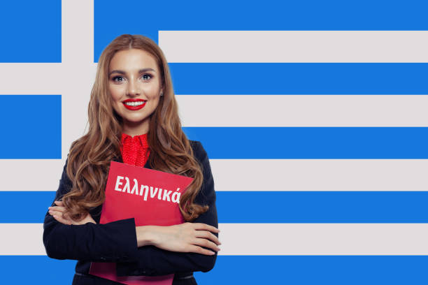 istock Greece and greek language concept. Smiling girl with book and Gr 1165188549