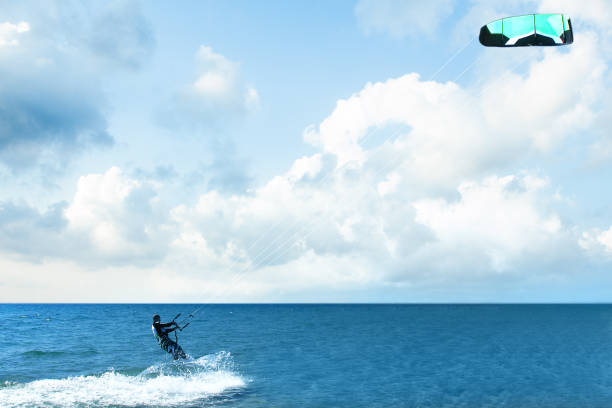 istock Kitesurfing riding over a surface of the Mediterranean sea with 1165190949