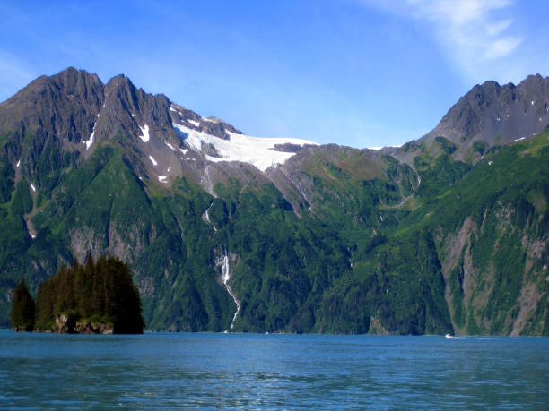 istock Boats Appear Small Under Anderson Glacier 1165191193