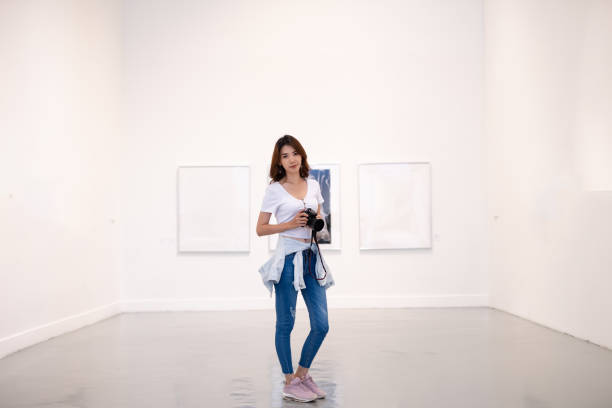 istock Beautiful girl photographer 1165192229