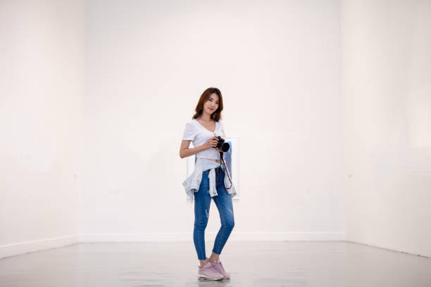 istock Beautiful girl photographer 1165192393