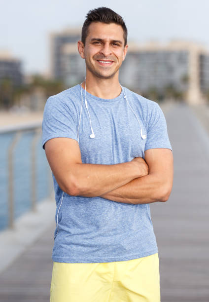 istock Sporty man posing outdoors 1165196572