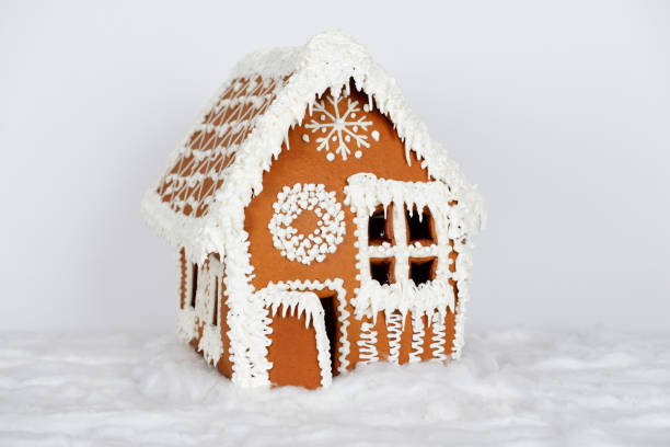 istock The hand-made eatable gingerbread house and snow decoration 1165199173