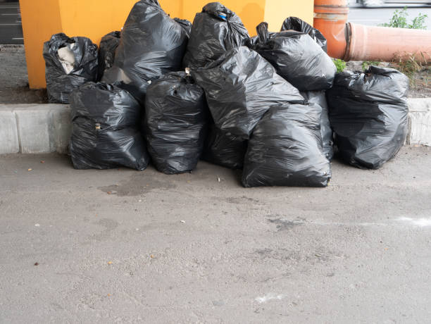 istock big pile of black plastic garbage trash bags 1165201221