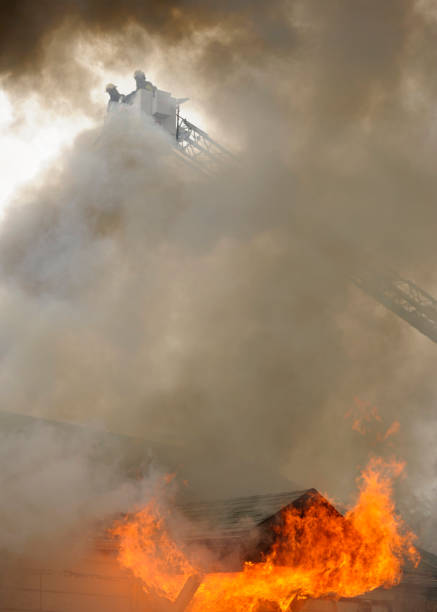 istock Residential home on fire at night fully engulfed. 1165202417