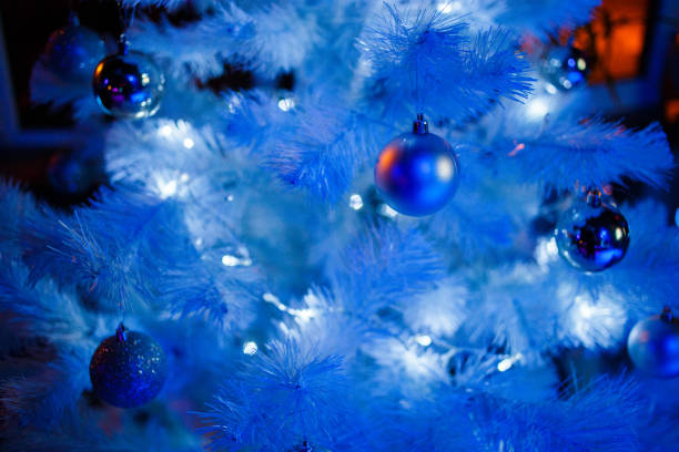 istock Christmas balls on a white fluffy Christmas tree 1165203240