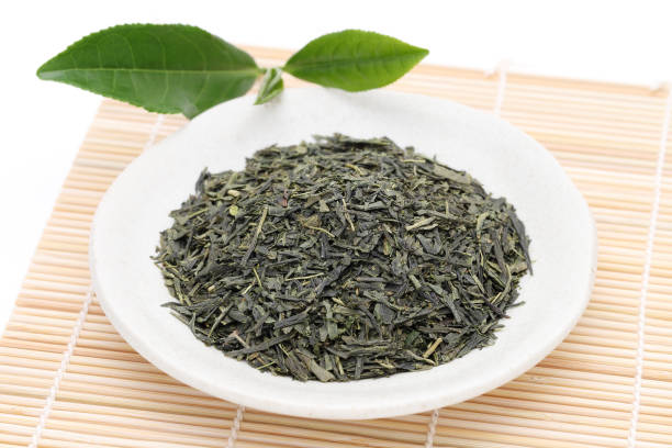 istock Dried tea leaves with green tea leaves 1165212621