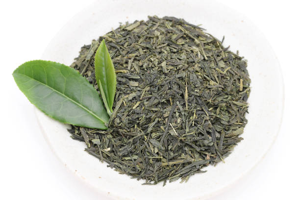 istock Dried tea leaves with green tea leaves 1165212622