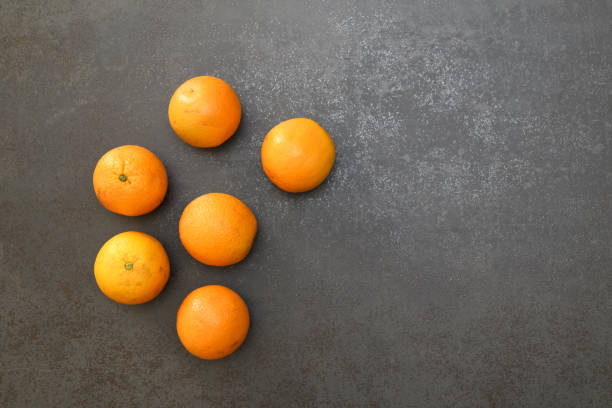 Six oranges on a solid background stock photo