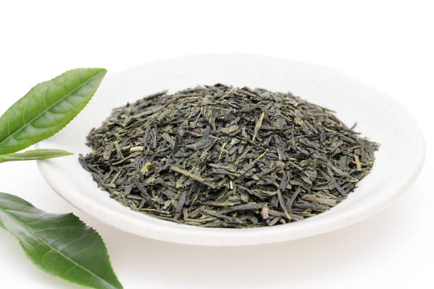 istock Dried tea leaves with green tea leaves 1165212632