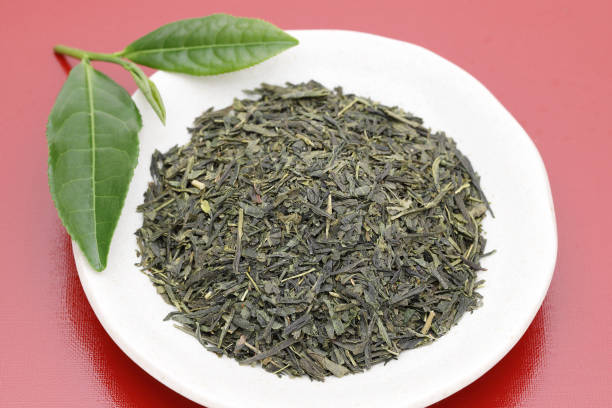 istock Dried tea leaves with green tea leaves 1165212633