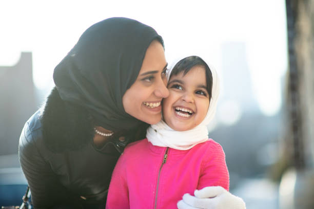 istock Smiling Muslim mother and child 1165214628