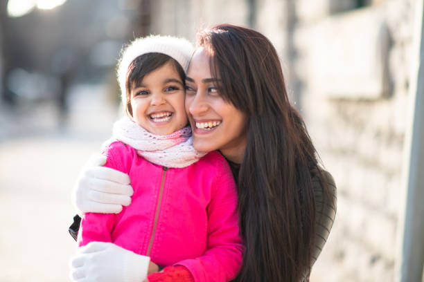istock Smiling Muslim mother and child 1165214651