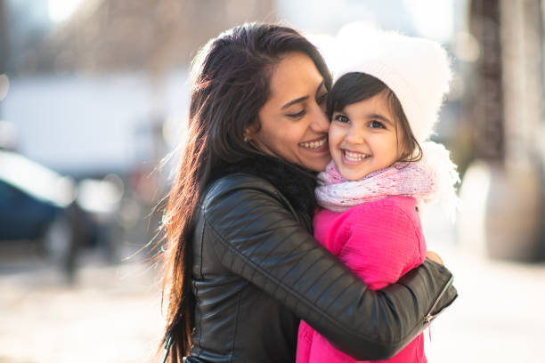 istock Smiling Muslim mother and child 1165214656