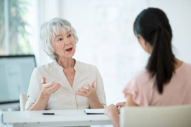 istock Senior woman meets with her physician 1165214767