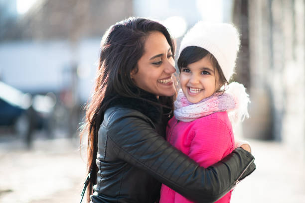istock Smiling Muslim mother and child 1165214778