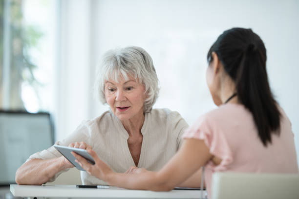 istock Senior woman meets with her physician 1165214779