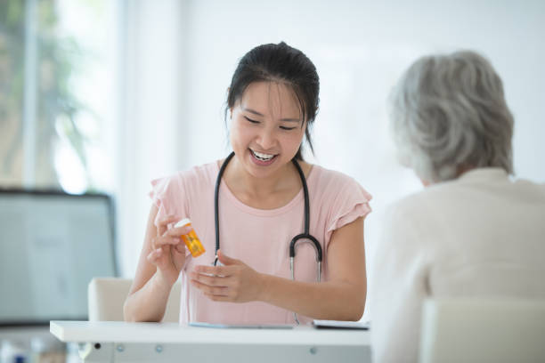 istock Female doctor meets with patient 1165214787