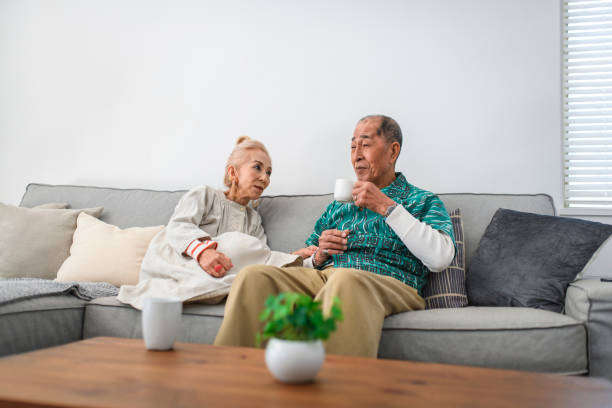 istock Senior Japanese Couple Enjoying Coffee and Conversation 1165214957