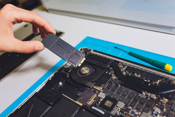 istock The engineer repairs the laptop pc, computer and the motherboard. Installs the equipment cpu. 1165215519