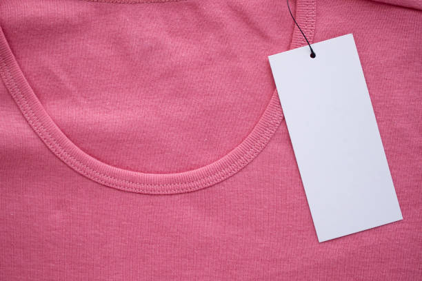 istock Blank white clothes tag label on new shirt 1165216239