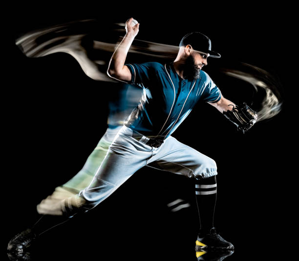 istock baseball player man isolated black background light painting 1165219692
