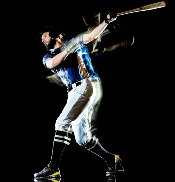 istock baseball player man isolated black background light painting 1165219704