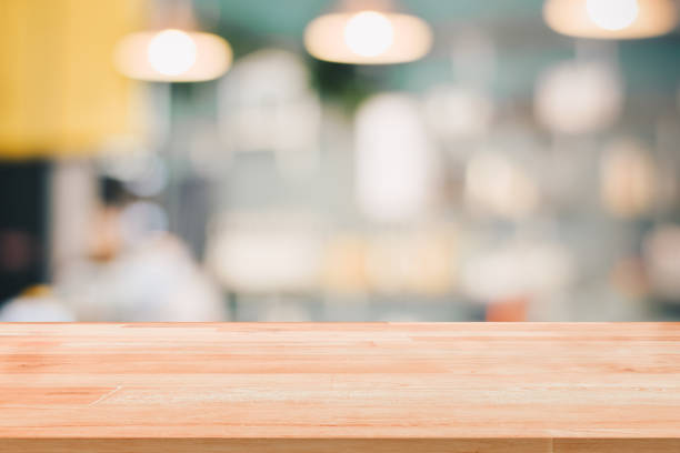 istock Blank Wood Table Top Reception Counter or Cash Counter on blurred background for montage product present 1165220493
