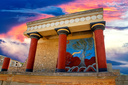 View of ancient ruines of famouse Knossos palace at Crete in Greece. Old walls of labyrinth Minotaur near Heraklion. Minoan palaces as largest archaeological site in Mediterranean island