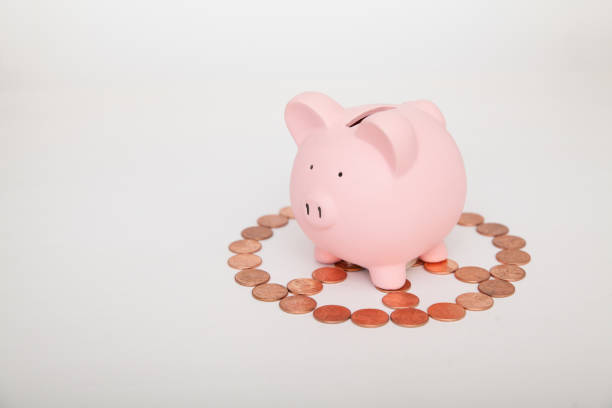 Piggy Bank on top of peace sign stock photo