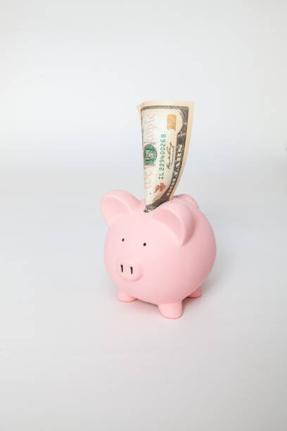 Piggy bank with $10 stock photo