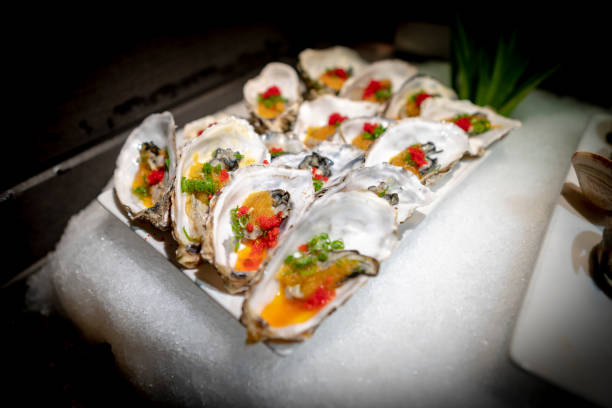 istock Delicious asian japanese style starter cold snacks sushi buffet table, oyster 1165237780