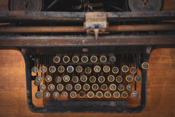 istock An old retro, Antique Typewriter. Vintage style, dusty surfaces 1165238365