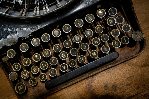 Details of an old retro, Antique Typewriter Keyboard. Vintage style, dusty surfaces, Close up Photo