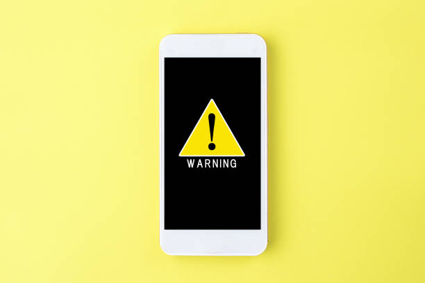 istock Warning sign on display of smart phone 1165238632