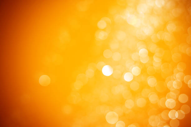 istock Abstract orange and yellow light bokeh background. 1165239724
