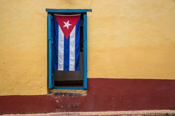 The Cuban flag in a window in Trinidad, Cuba.