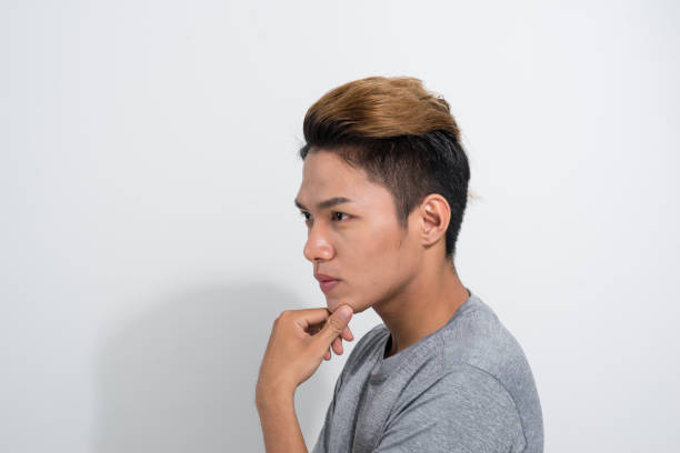 istock Asian young man Thinking something on white background 1165241935
