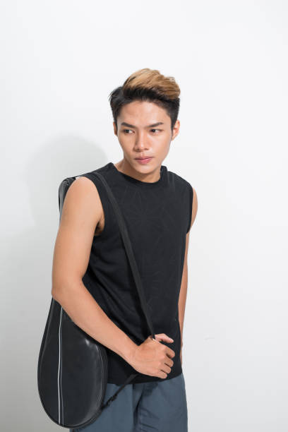 istock Asian badminton player with bag on white background 1165242627