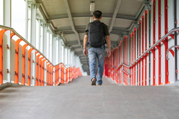 istock Man walking in the city 1165248337