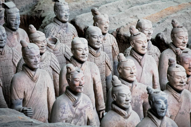 World famous Terracotta Army located in Xian China The world famous Terracotta Army, part of the Mausoleum of the First Qin Emperor and a UNESCO World Heritage Site located in Xian China terracotta soldiers stock pictures, royalty-free photos & images