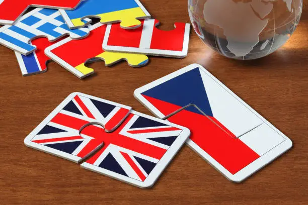 puzzle with the national flag of England and Czech on wooden table