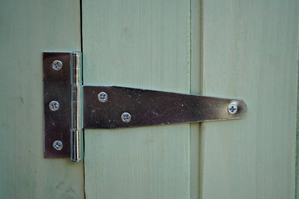 istock Close up of silver metal door hinges 1165249391