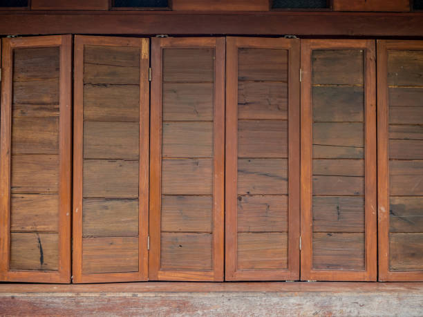 istock The wood wall and window on stones basement 1165249529