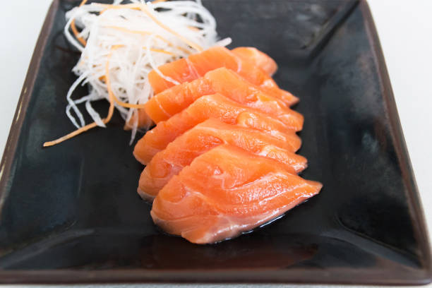 istock Fresh salmon sashimi serve on plate. Japanese food style. 1165250524