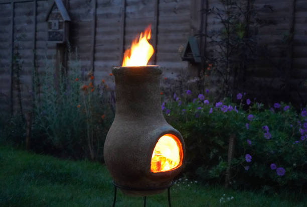 istock Chiminea on fire in a garden 1165250573