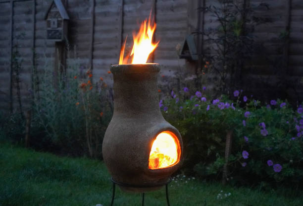 istock Chiminea on fire in a garden 1165251238