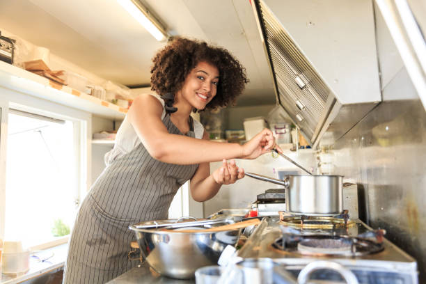 istock Attractive Afro female fast food worker 1165251355