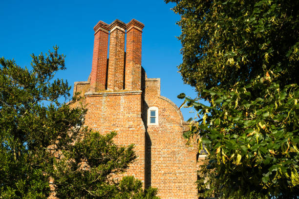 Both bricks and mortar have been renovated to a high standard. Seen against a blue sky.