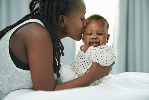 Shot of a mother and her newborn baby at home